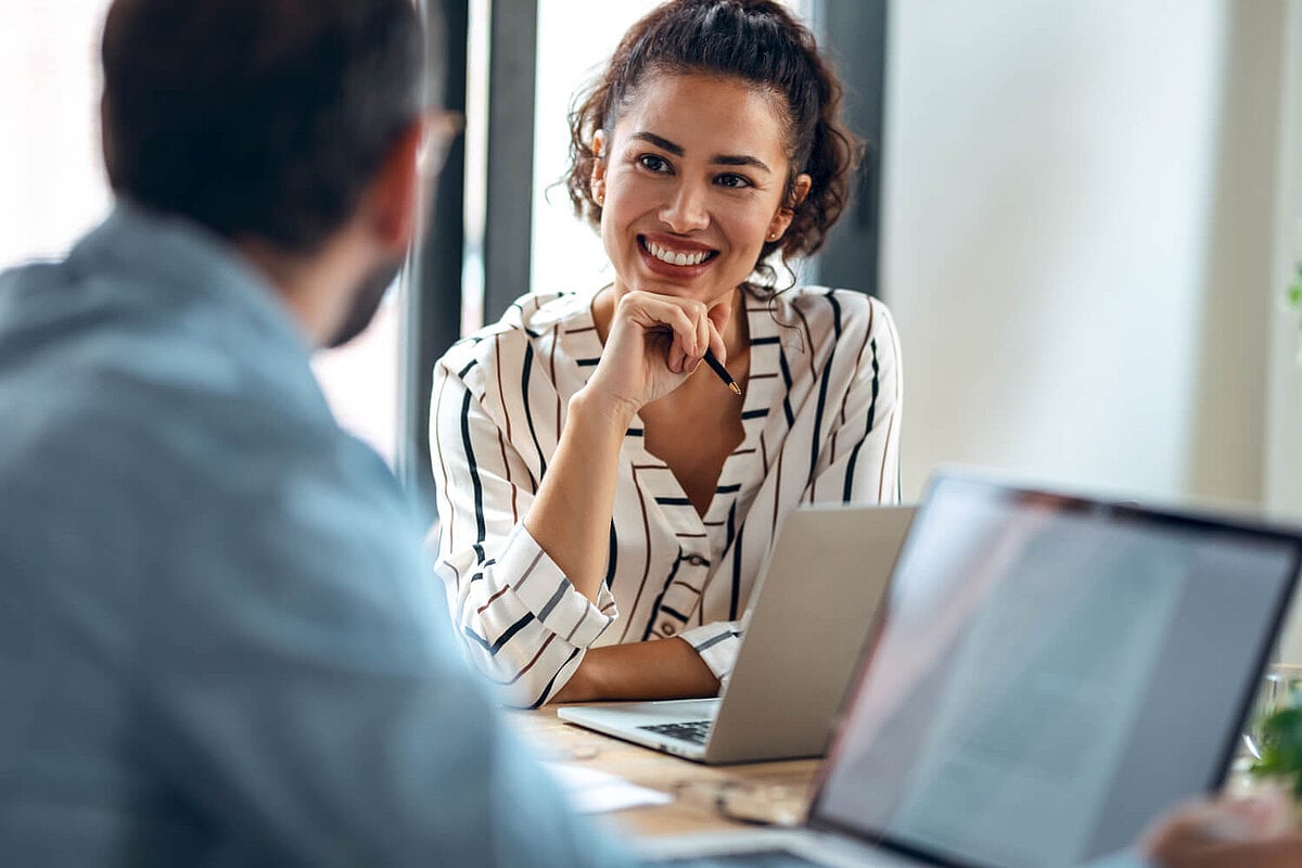 Colleagues at work and colleagues chat using your French for beginners from iQ Lingua